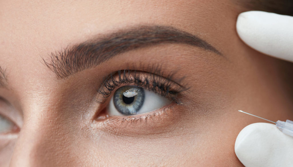 Closeup oF Beautiful Woman Face Getting Skin Lift Injection
